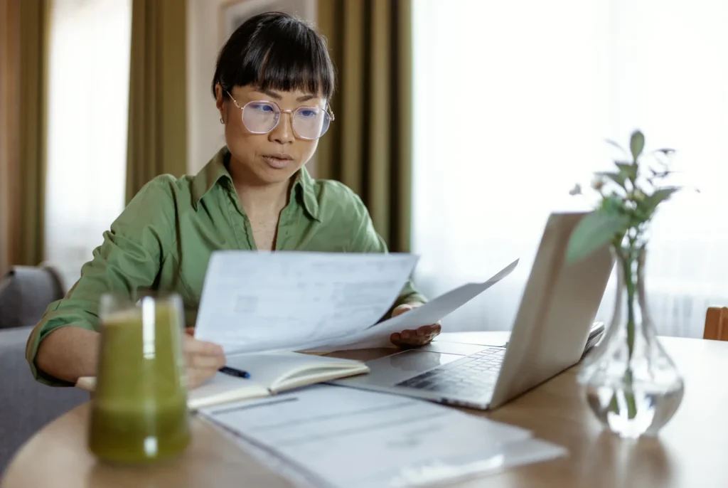 Person reviewing Tax Returns and Other Documents