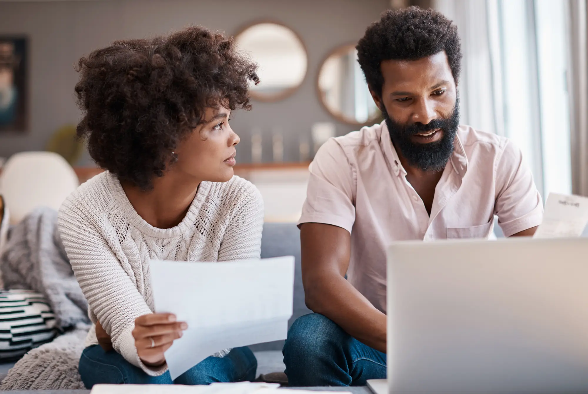 Couple discussing good debt vs. bad debt