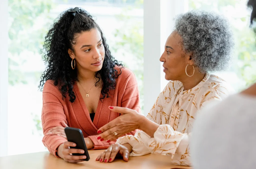 Mom and daughter discussing tailored insurance solutions