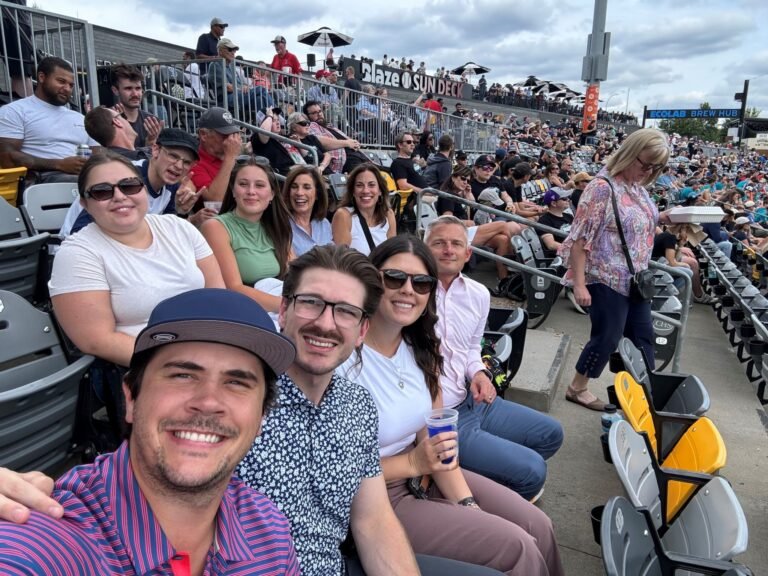 Minneapolis team enjoying a day at the ballpark watching the St. Paul Saints
