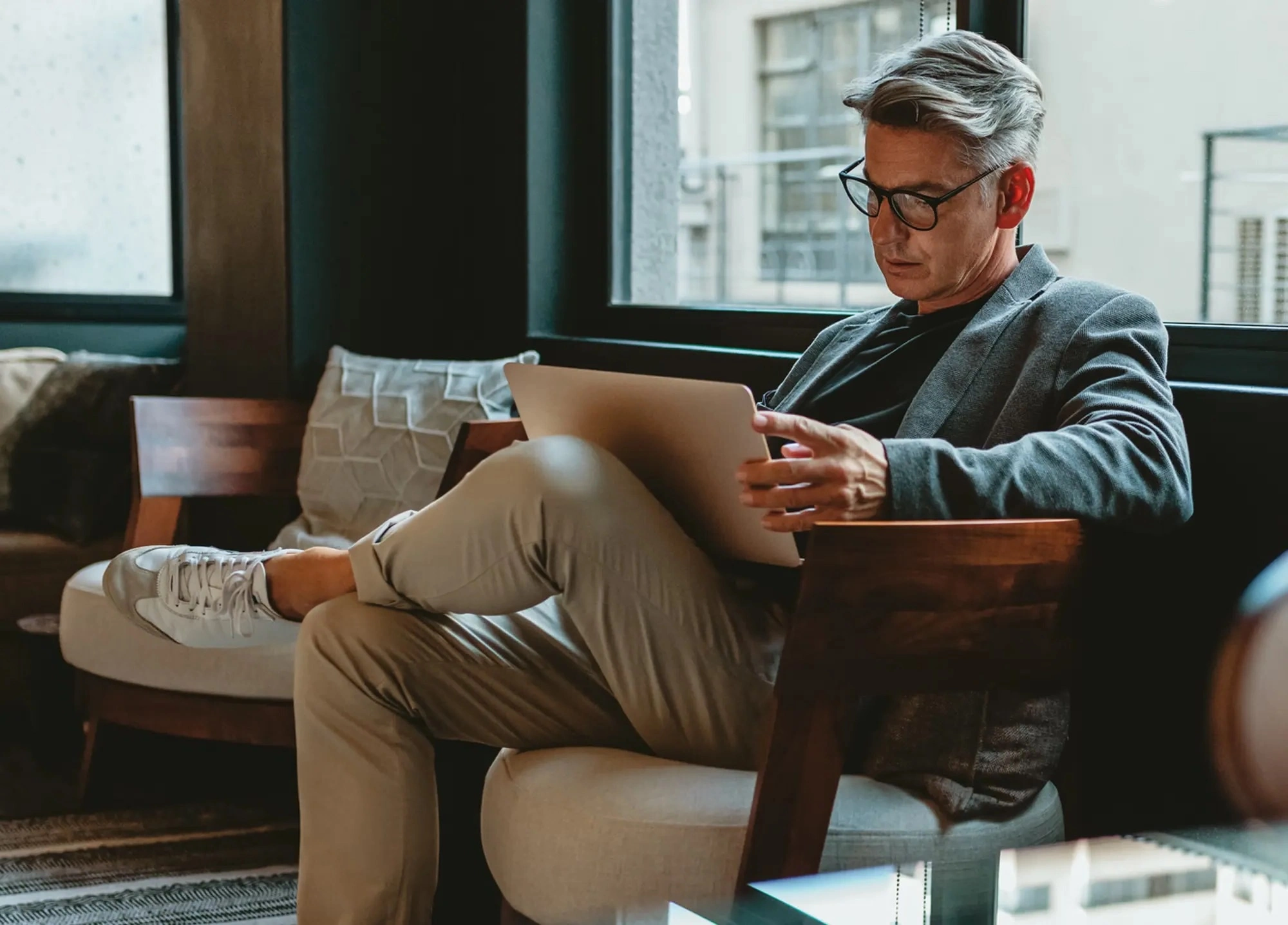 professional man monitoring investments on his home computer