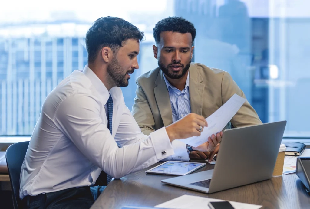 investor and advisor looking at documents
