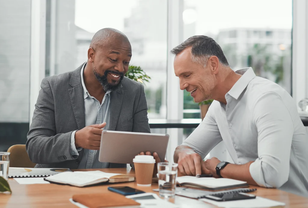 Man sitting with tax advisor discussing options