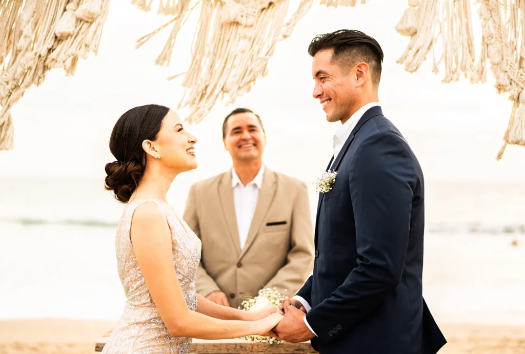 a couple standing at the altar during their wedding